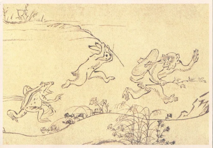 Ancient Japanese manga depicting a frog chasing a rabbit, who in turn chases a monkey.